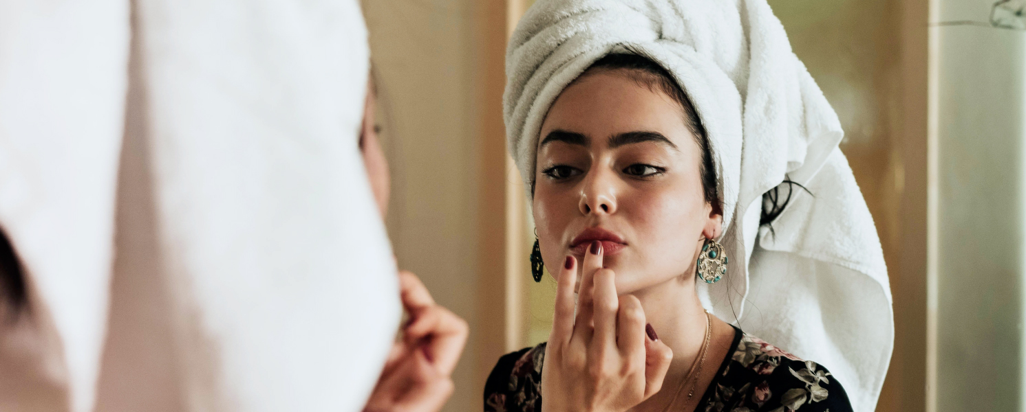 Girl doing makeup in dorm