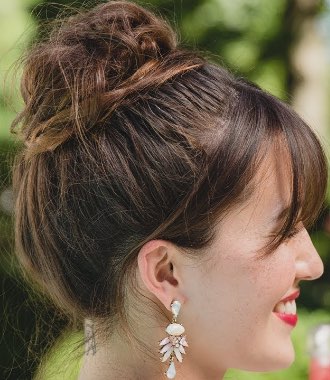 Photo of top knot with a twist hairstyle