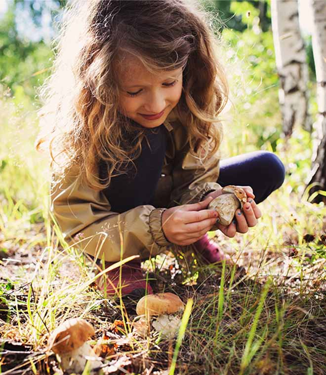 Little girl playing in the dirt