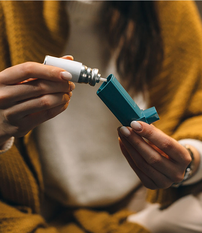 Woman putting together an inhaler