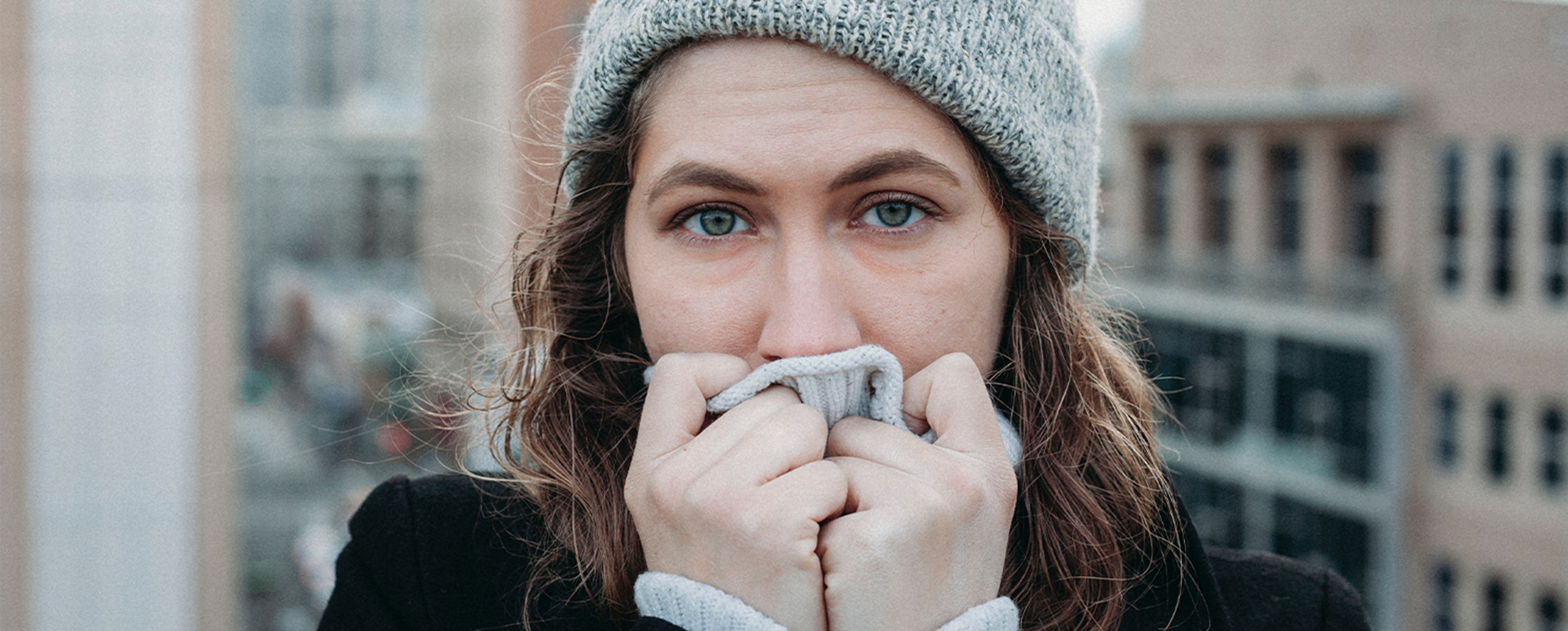 Cold woman in gray hat