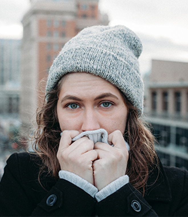 Woman in gray hat outside