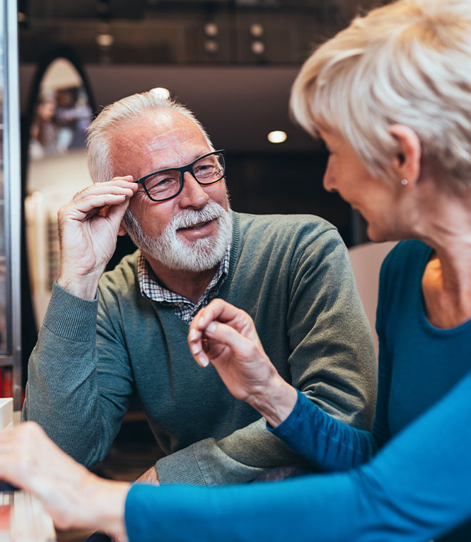 Man in his 70s with beard and glasses