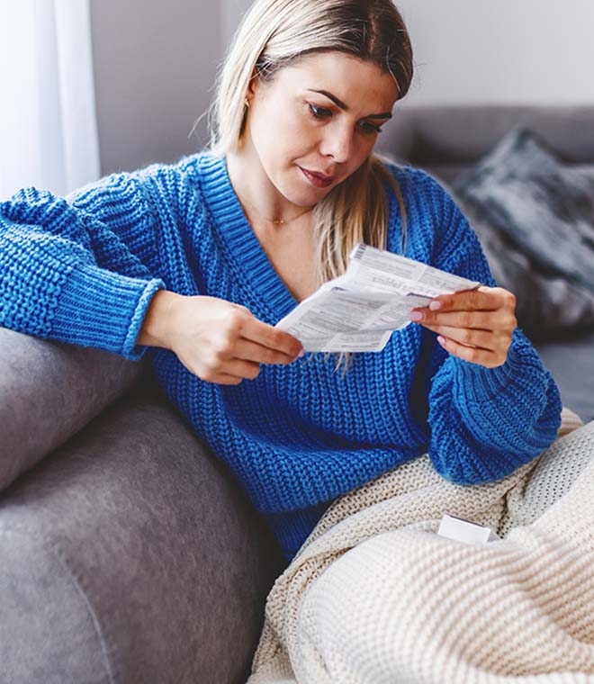 Woman reading medication information