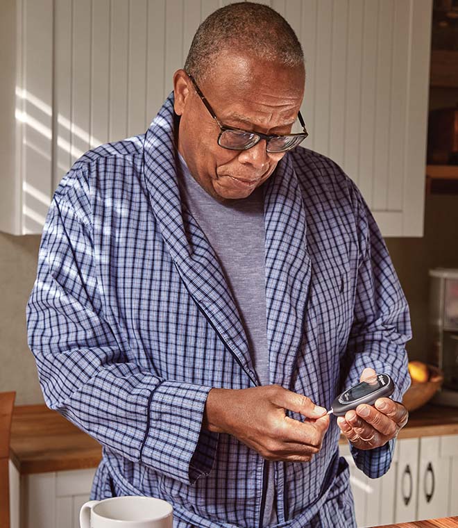 Man monitoring his blood sugar