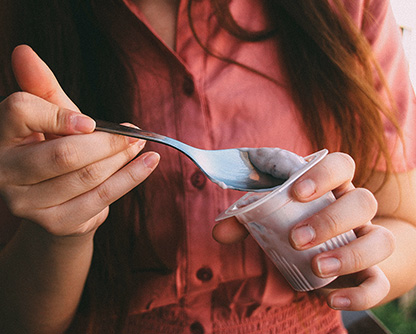 Woman eating yogurt