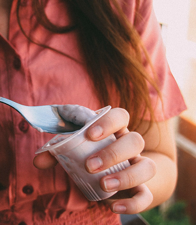 Woman eating yogurt