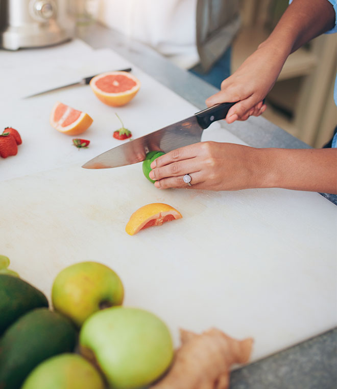 Slicing a lime on a cutting board