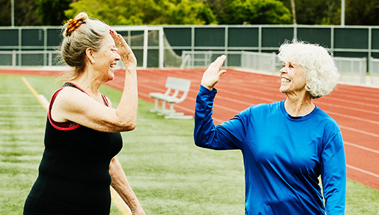 Women giving each other a high five