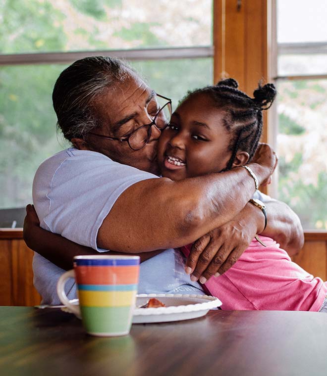 Young girl hugging her grandma