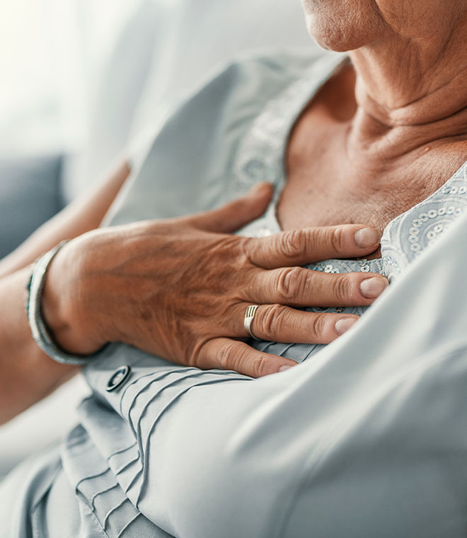 Woman holding her chest