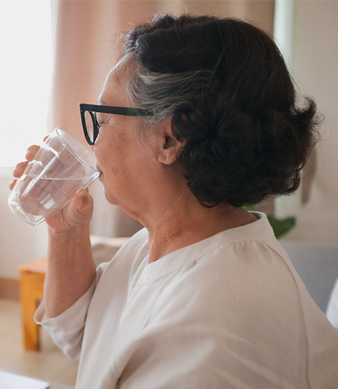 Woman in her 60s taking medication