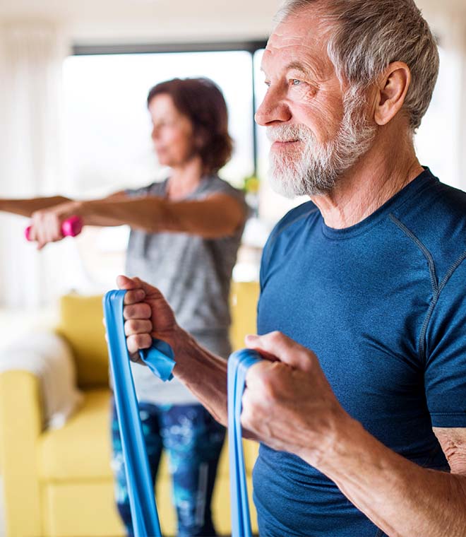 Older couple working out at home