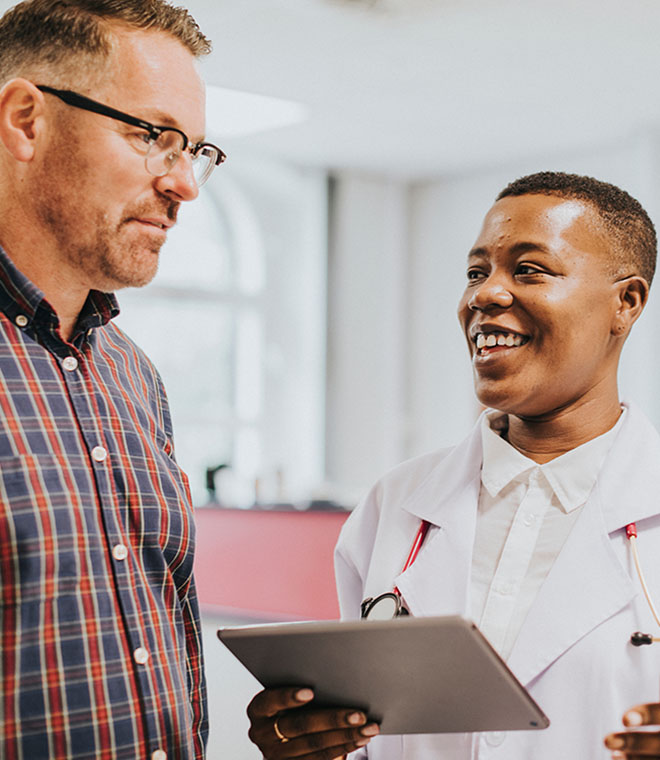 Cheerful physician giving a patient news