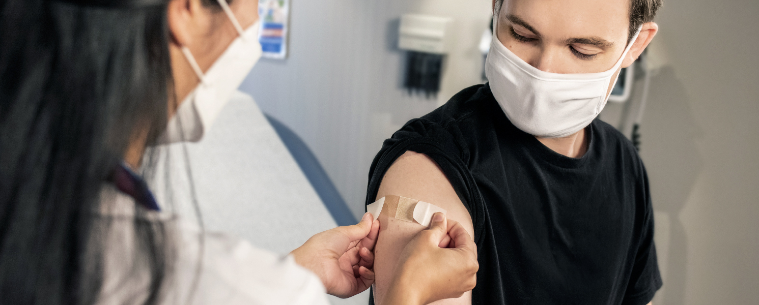 Young man getting vaccine