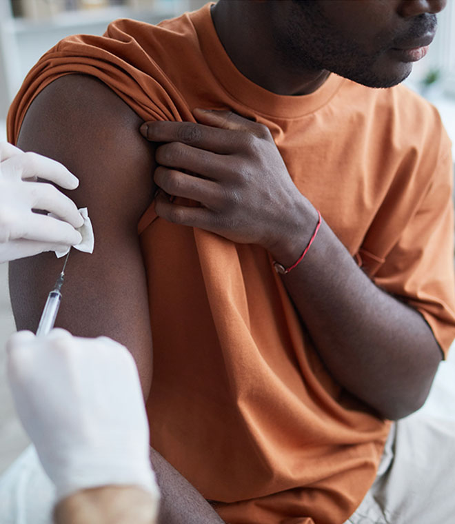 Black man receiving a shot