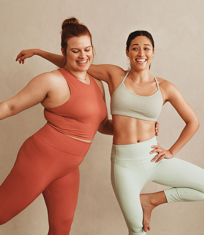 Two young women exercising together