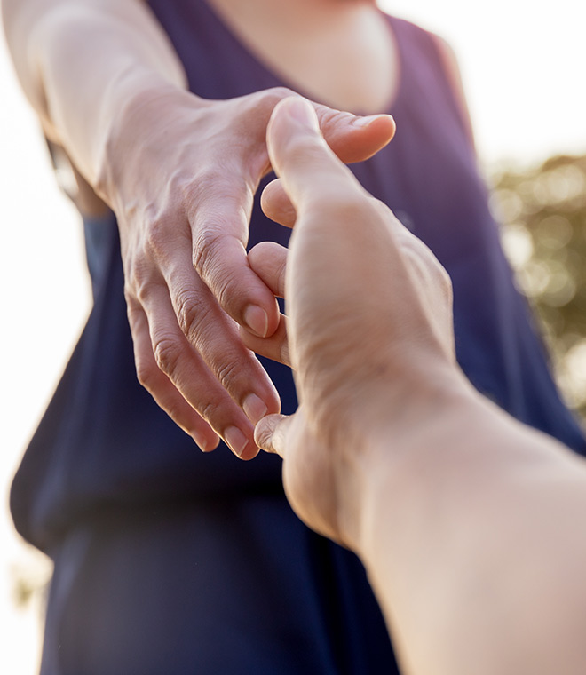 Man and woman holding hands