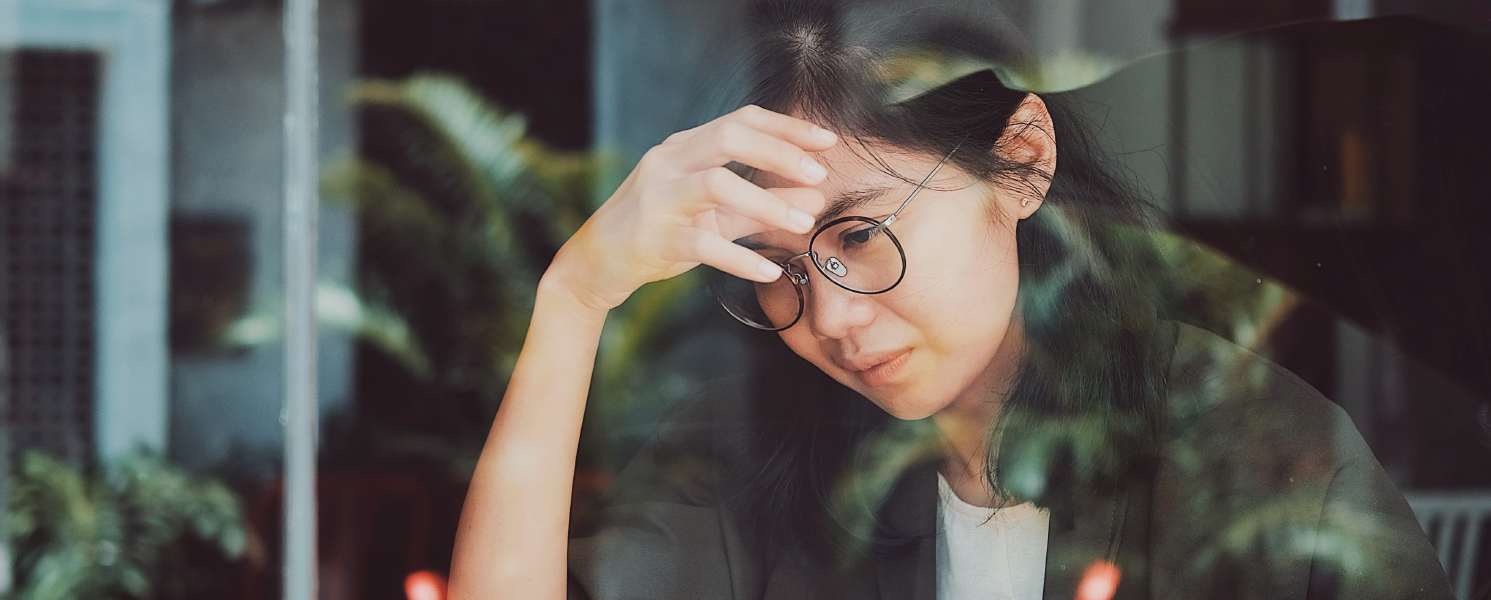 Woman stressed through window