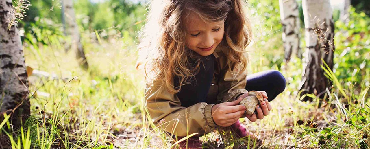 Little girl playing in the dirt