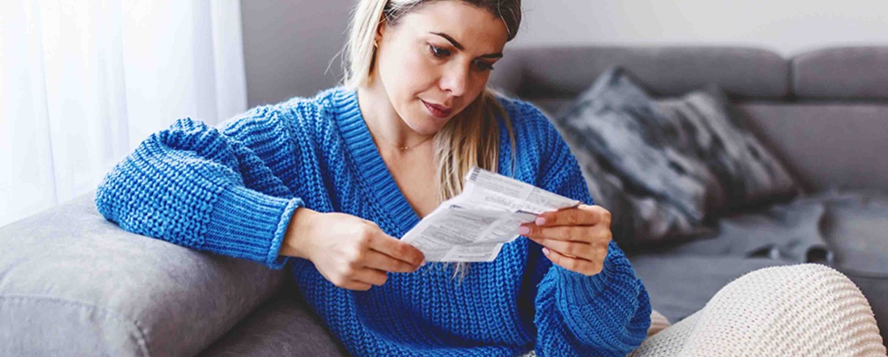 Woman reading medication information